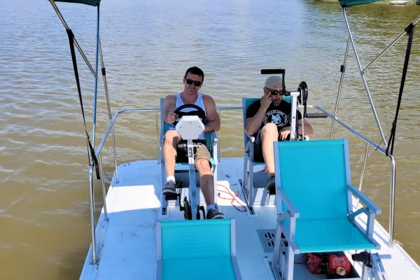 Serenity 550 Fitness - catamaran as big water bike on lake - helmsman view
